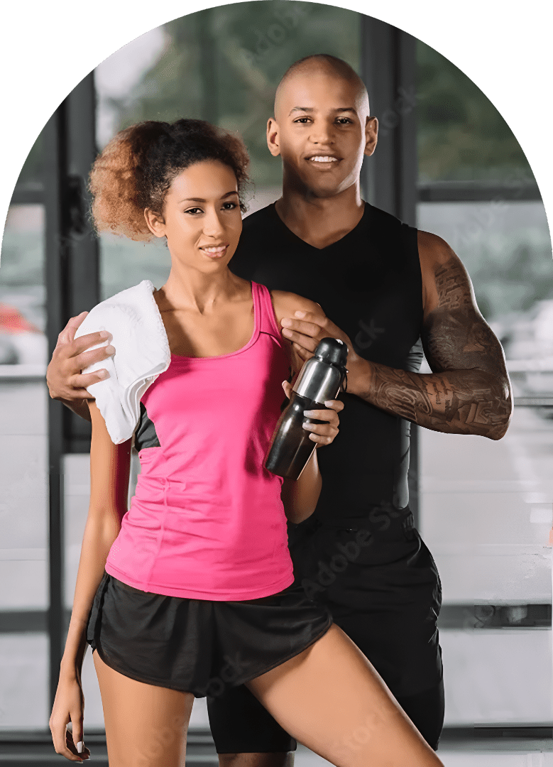 Couple in gym wear holding water bottles.