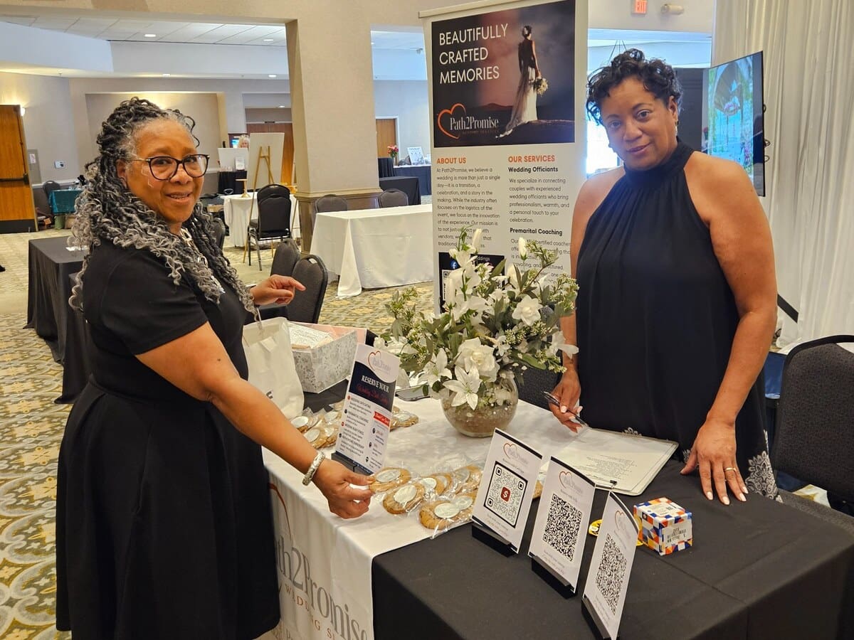 Path2Promise representatives welcoming visitors at a Georgia bridal expo