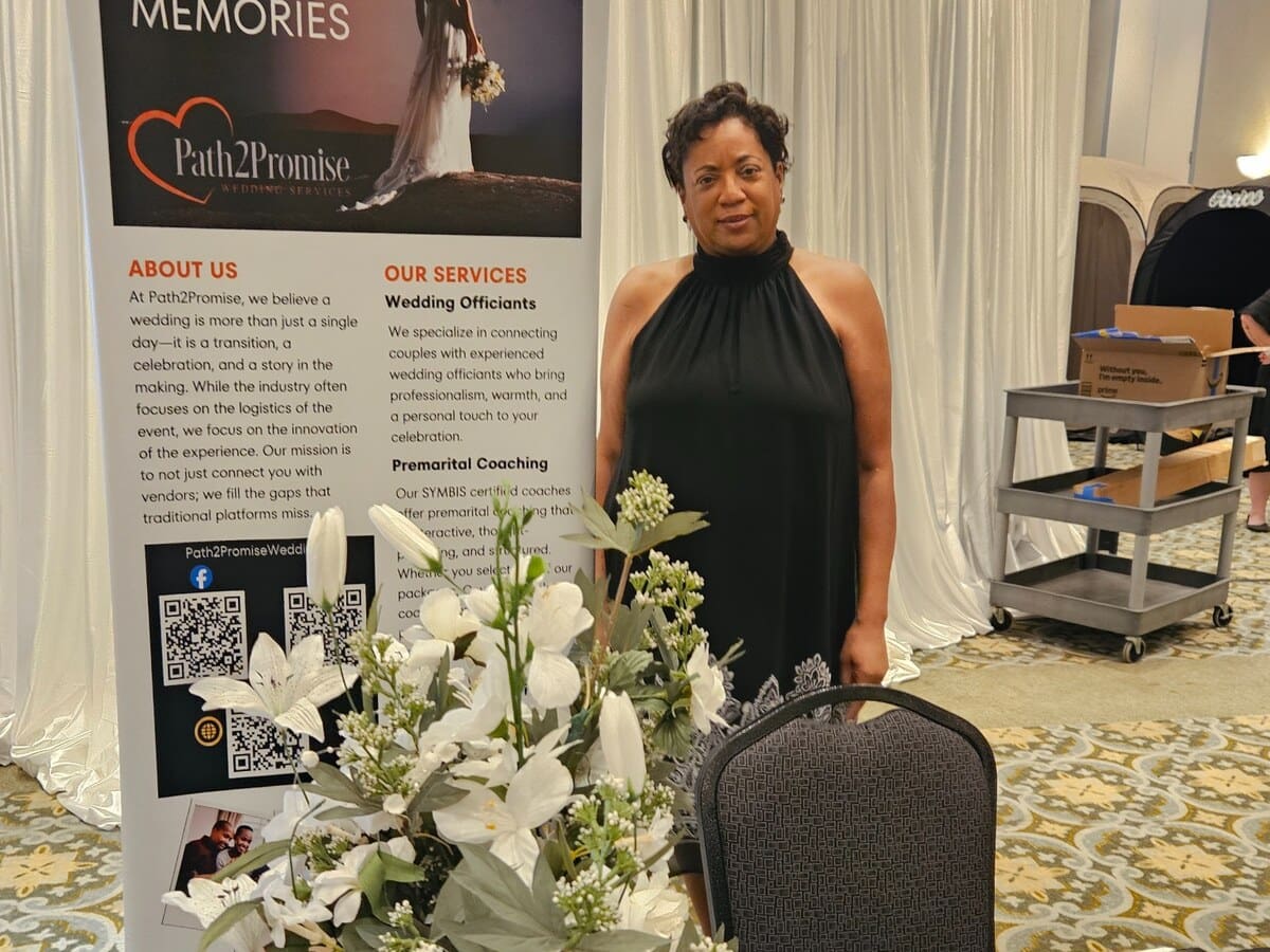 Path2Promise representative welcoming couples at the bridal expo booth