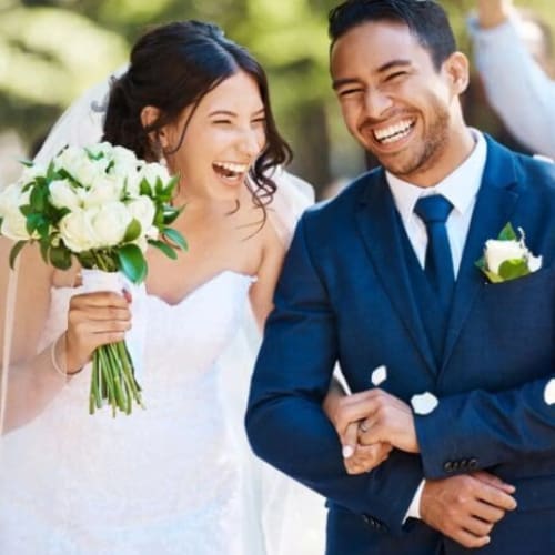 Joyful bride and groom after vows