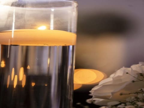 Candlelight reflection in a glass holder
