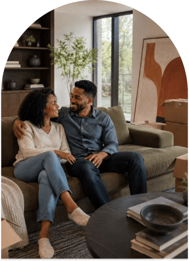 Couple sitting together in their new home.