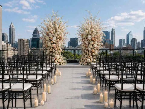 Elegant rooftop wedding setup with flowers